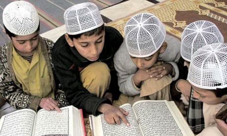 Pakistani students recite the Koran