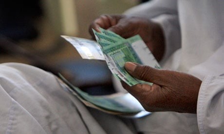 Counting money in Khartoum