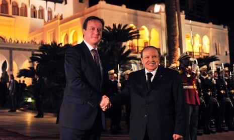 Algerian President Abdelaziz Bouteflika welcomes  David Cameron in the Palais du Peuple office, in Algiers last night.