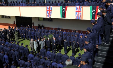Cameron takes part in a graduation ceremony for Police Officers as part of a visit in Libya.
