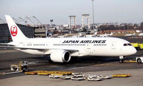 A Japan Airlines Boeing 787 Dreamliner is towed back to the gate after a fuel leak