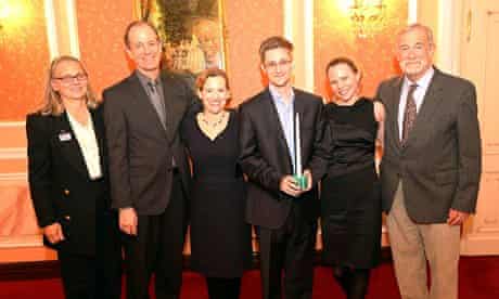 Edward Snowden, holding the Sam Adams award for integrity in intelligence, in Russia