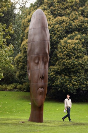 A man admires Jaume Plensa's sculpture entitled Chloe in Regent's Park, which is part of the Frieze London art fair.