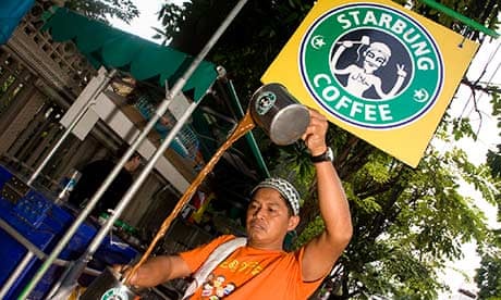 Damrong Maslae in front of his Starbung stall in Bangkok.