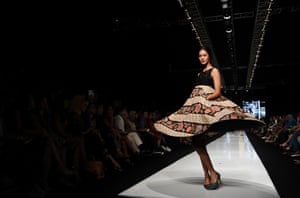 A model showcases designs by Edward Hutabarat on the runway at the Parang show during Jakarta Fashion Week 2014 at Senayan City in Jakarta, Indonesia.