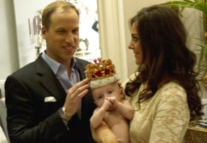 Who wears the crown? Little Prince George tries it for size.