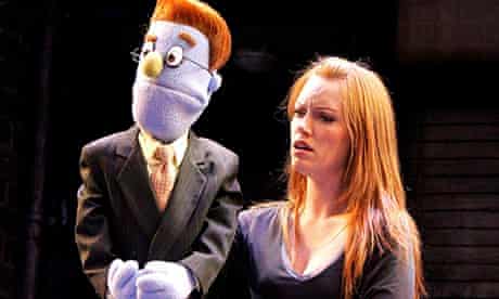 Performer and puppet in Avenue Q