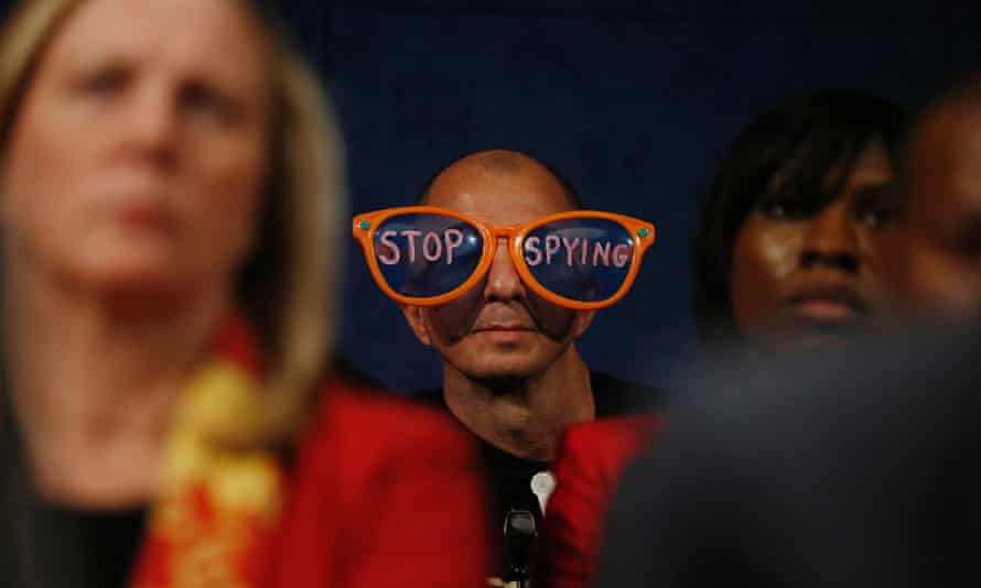 A protester against the practices of US security agenices sits in the audience as intelligence officials testify at a hearing on Capitol Hill.