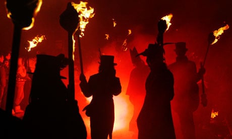 Participants carrying flaming torches during the Bonfire Night procession in Lewes 5 November 2008