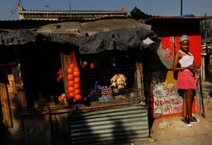 Alexandra Township: Girl stands by spaza shop