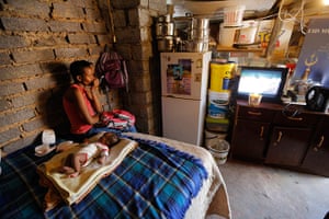 Alexandra Township: A mother watches television