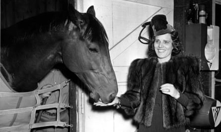 Seabiscuit gets a carrot from owner Mrs Charles Howard in Baltimore