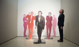 The British fashion designer, Paul Smith, poses for pictures with cardboard models of himself at a photocall to launch Hello, My Name is Paul Smith, an exhibition at the Design Museum celebrating his forty years in the fashion and design industry.