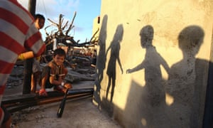 Children play in an area of the Filipino town of Guiuan badly affected by Typhoon Haiyan.