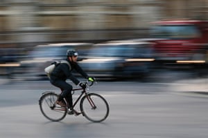 A Commuter cycles in central London. The deaths of five cyclists in just nine days on the roads this month in London have prompted calls for the city's mayor Boris Johnson to speed up road safety measures in the capital.