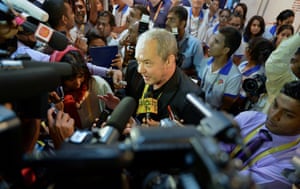 British Channel 4 television director Callum Macrae (C) is mobbed by journalists at the media centre at the Bandaranaike Memorial International Conference Hall on the inaugural day of the Commonwealth Heads of Government Meeting in Colombo. Britain's Channel 4 which produced an award-winning documentary on alleged war crimes during the island's ethnic war,  faced a pro-government protest on their arrival and had more trouble travelling to the former war zone in the northeast November 13.