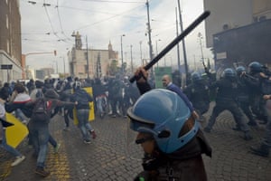 Demostrators and police forces clash during a student rally in central Naples, Italy. Students were protesting all over the country against the government's austeriity measures and cuts in the education system planed in the 2014 budget bill.