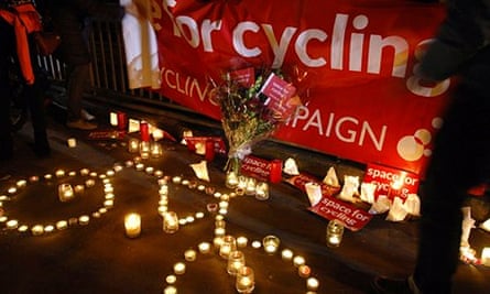 Members of the public at a shrine for the cyclist killed in Bow, east London