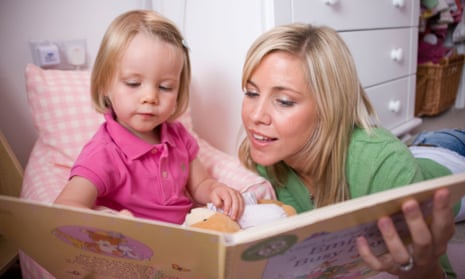 A mother reads to her daughter.