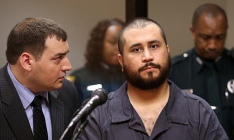 George Zimmerman listens to defense counsel Daniel Megaro at the hearing.