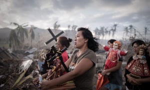 Survivors of Super Typhoon Haiyan march during a religious procession in Tolosa on the eastern Philippine island of Leyte.