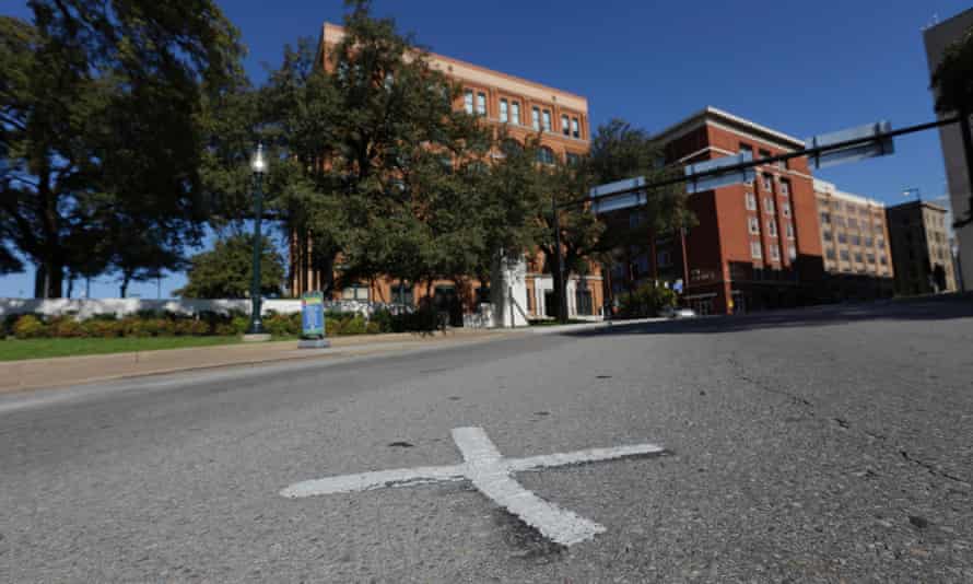 In this file photo, an X marks the spot on Elm Street where the first bullet hit President John F Kennedy. The Xs on the street  are gone.