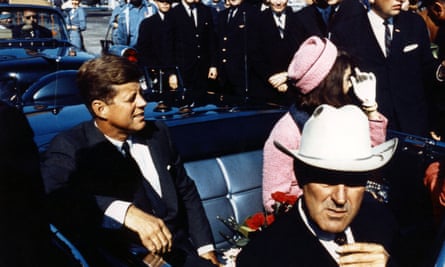 Texas Governor John Connally adjusts his tie as President John F Kennedy and his wife prepare for their tour of Dallas, Texas.