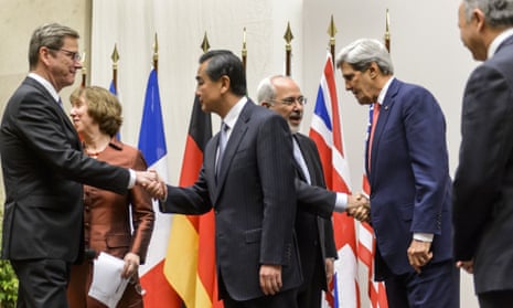 German foreign minister Guido Westerwelle, EU foreign policy chief Catherine Ashton, Chinese foreign minister Wang Yi, Iranian foreign minister Mohammad Javad Zarif, US secretary of state John Kerry and French foreign minister Laurent Fabius shake hands after the deal.