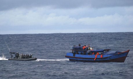 The Australian Navy stops a boat carrying asylum seekers