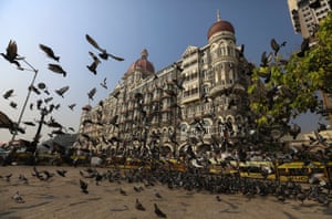 Pigeons fly in front of the Taj Mahal hotel, one of the sites of the 26 November 2008 terrorist attacks, in Mumbai.