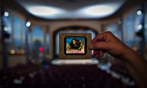 Cinema owner Ann Nelson holds up an original slide from the movie Casablanca inside The Patricia Theatre in Powell River, British Columbia. The Patricia was founded in 1913 and has been running continuously since it opened.