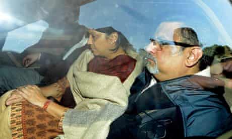 Nupur and Rajesh Talwar inside a car as Indian police drive them from court