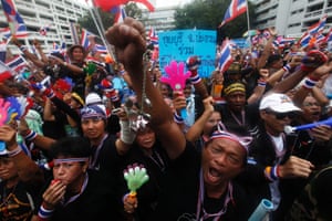 Anti-government protesters shout slogans at the Finance Ministry in Bangkok which they have occupied since Monday.