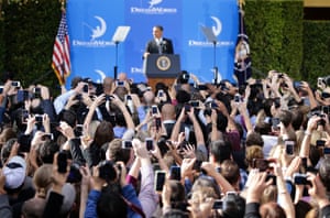 People take pictures of President Barack Obama as he speaks at the DreamWorks Animation studio in Glendale, California. Obama was wrapping up a three-day West Coast tour by making an economic pitch at the studio of movie producer Jeffrey Katzenberg, one of his top fundraisers and political supporters.