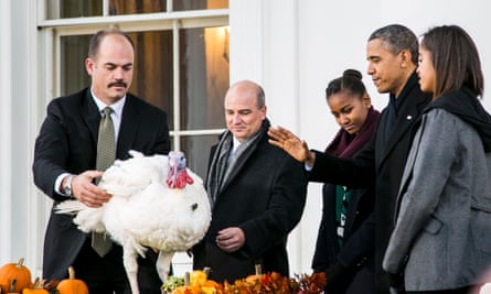 President Barack Obama, with his daughters Sasha and Malia, pardons Popcorn, the National Thanksgiving Turkey, and his alternate Caramel in a ceremony on the North Portico at the White House .