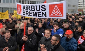 Employees of Airbus demonstrate against the planned layoffs at the outside of the factory gates European Aeronautic Defence and Space Company (EADS) in Bremen, Germany, 28 November 2013.