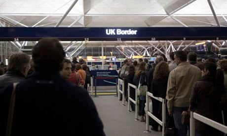 People queuing at immigration UK border, Stansted airport, London, England, Europe.