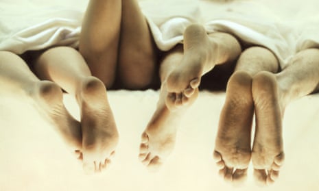 bed feet - end of monogamy piece in Review - four people - sexual activity - lying down - duvet -  bd3530-001 Credit: Stone/Getty Creative