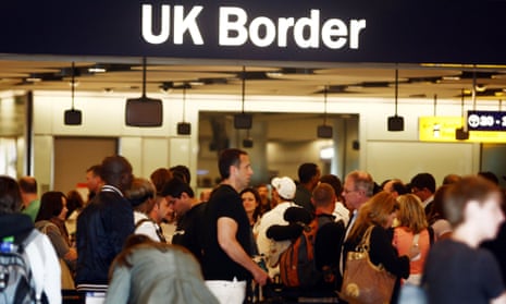 People queue for border checks at Heathrow airport