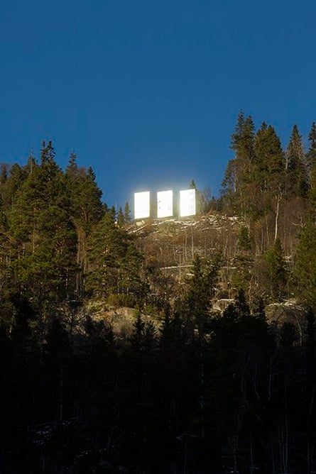 Sunlight reflects off the three giant mirrors.