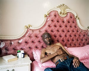 Big Pic - South Africa: sick man lying on pink bed