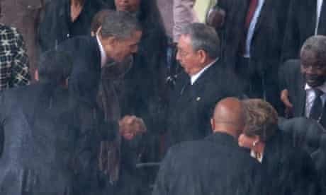 Barack Obama shakes hands with Cuban President Raul Castro during the memorial service for Nelson Mandela in Johannesburg, South Africa.