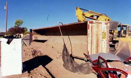 The scene in Albuquerque after a semi-trailer carrying sand overturned, suffocating a woman