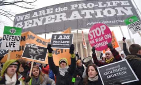 Anti-abortion activists hold placards infront of the US Supreme Court during the annual "March for Life" on January 25, 2013 in Washington, DC