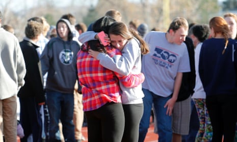 Students at Arapahoe high school comfort each other.