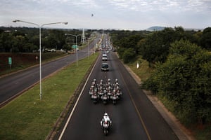 Qunu awaits: Motorcycles escort the hearse