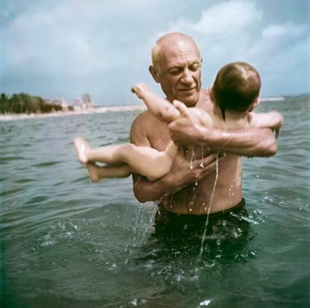 Pablo Picasso playing in the water with his son Claude, Vallauris, France, 1948