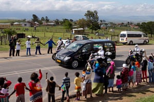 Nelson Mandela: People hold hands as the hearse proceeds to Mandela's hometown
