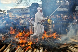 Weekend in pictures: Sakuragawa City, Japan: A Shinto priest walks across embers during a fire w