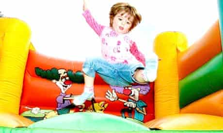 Child on bouncey castle